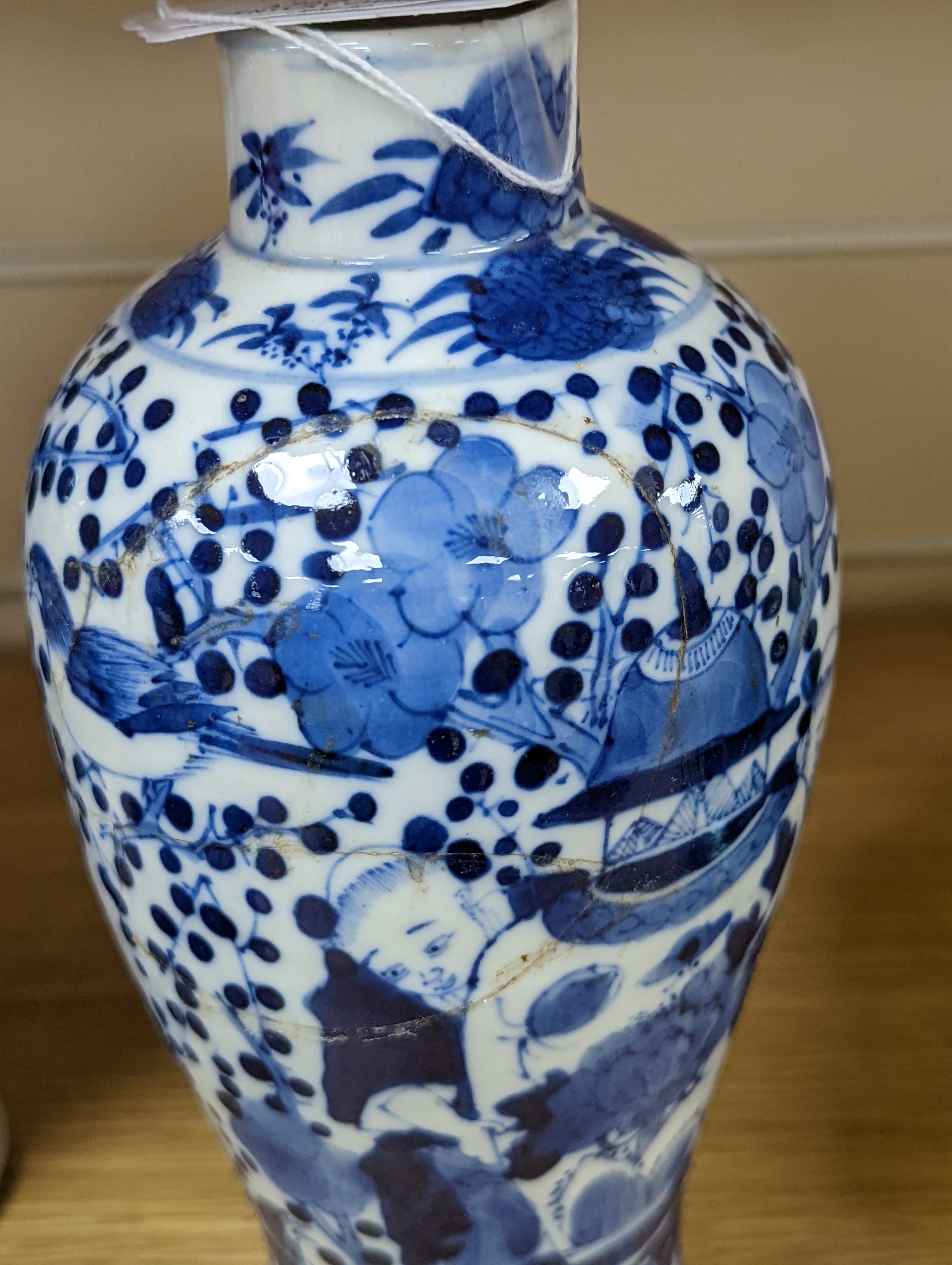 A pair of 19th century Chinese blue and white vases, a prunus vase and cover and a similar jar (4), pair of vases 24 cms high.